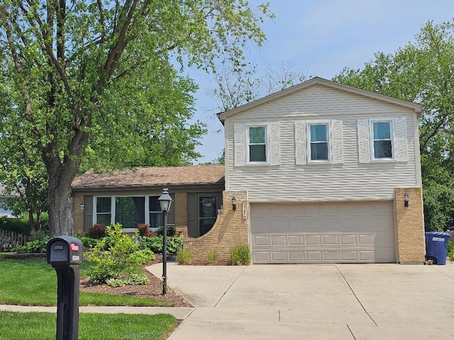 6S141 Park Meadow Dr, Naperville, IL 60540 - tri-level home with a garage, driveway, and brick siding