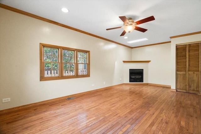 1132 10 Pin Ln, Beach Park, IL 60099 - unfurnished living room featuring hardwood / wood-style flooring, a ceiling fan, a fireplace, ornamental molding, and recessed lighting