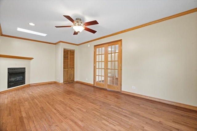 1132 10 Pin Ln, Beach Park, IL 60099 - unfurnished living room featuring wood finished floors, ceiling fan, baseboards, ornamental molding, and a fireplace
