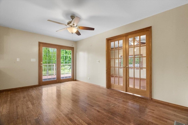 1132 10 Pin Ln, Beach Park, IL 60099 - unfurnished room with a ceiling fan, wood finished floors, french doors, and baseboards