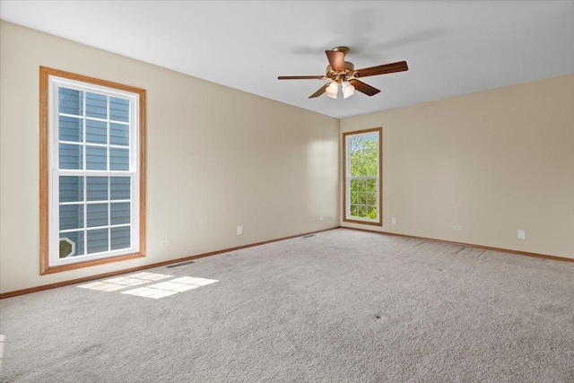 1132 10 Pin Ln, Beach Park, IL 60099 - spare room with baseboards, carpet flooring, and ceiling fan