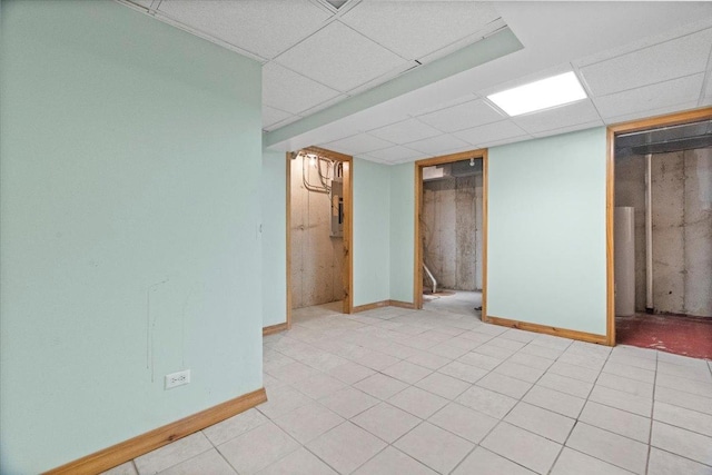 1132 10 Pin Ln, Beach Park, IL 60099 - finished below grade area featuring a paneled ceiling, baseboards, electric panel, and light tile patterned floors