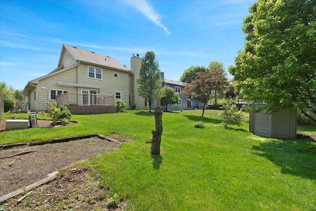 1132 10 Pin Ln, Beach Park, IL 60099 - back of house featuring a wooden deck, a lawn, and a chimney