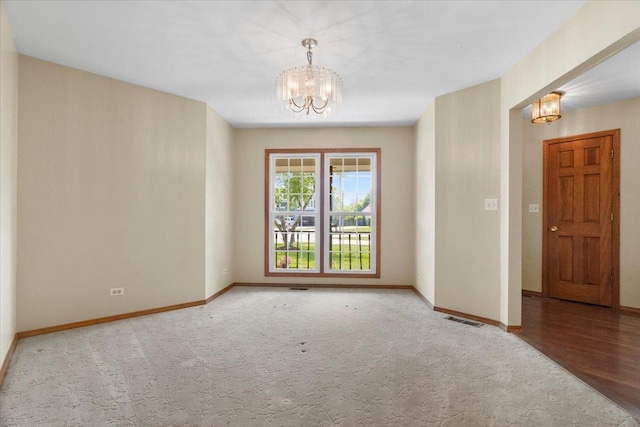 1132 10 Pin Ln, Beach Park, IL 60099 - empty room featuring a chandelier, baseboards, and carpet floors