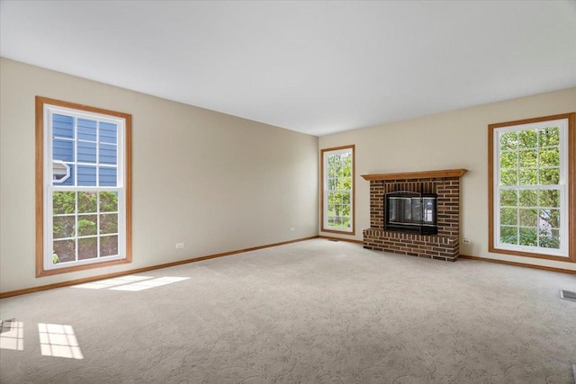 1132 10 Pin Ln, Beach Park, IL 60099 - unfurnished living room with baseboards, carpet floors, and a brick fireplace