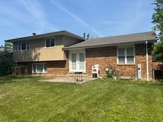 18644 Aberdeen St, Homewood, IL 60430 - back of property with a patio and a lawn