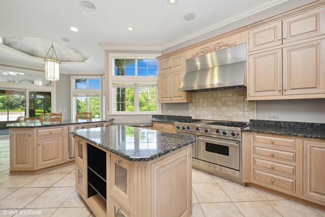 29026 N Brassie Ct, Ivanhoe, IL 60060 - kitchen featuring wall chimney range hood, high end stainless steel range oven, light tile patterned floors, crown molding, and a kitchen island