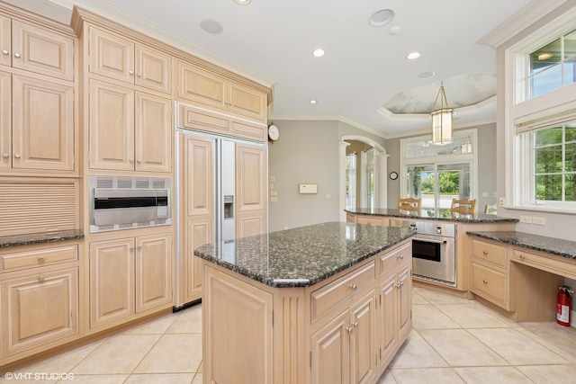 29026 N Brassie Ct, Ivanhoe, IL 60060 - kitchen featuring oven, light tile patterned flooring, white microwave, arched walkways, and ornamental molding