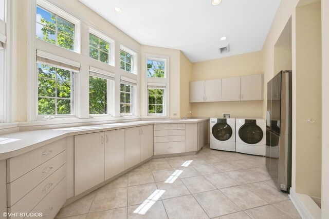29026 N Brassie Ct, Ivanhoe, IL 60060 - laundry room featuring cabinet space, separate washer and dryer, light tile patterned floors, and recessed lighting