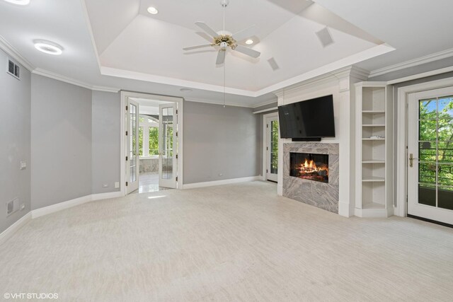 29026 N Brassie Ct, Ivanhoe, IL 60060 - unfurnished living room with a raised ceiling, a ceiling fan, a fireplace, light colored carpet, and baseboards