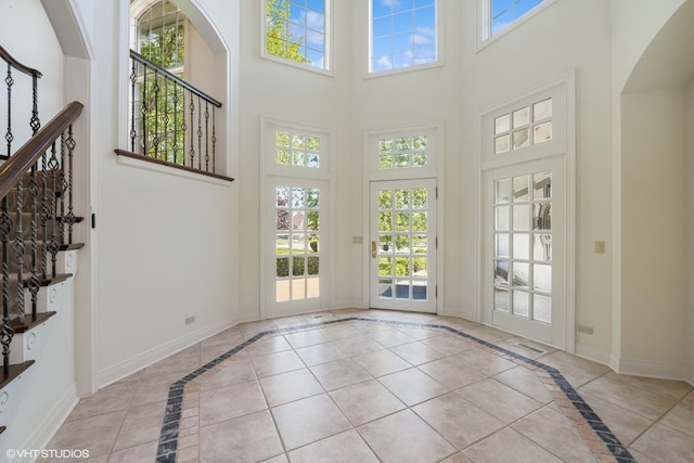 29026 N Brassie Ct, Ivanhoe, IL 60060 - interior space with a towering ceiling, healthy amount of natural light, inlaid floor details, and baseboards