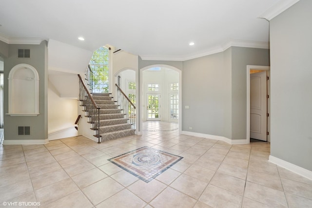 29026 N Brassie Ct, Ivanhoe, IL 60060 - entrance foyer with arched walkways, stairs, light tile patterned floors, ornamental molding, and baseboards