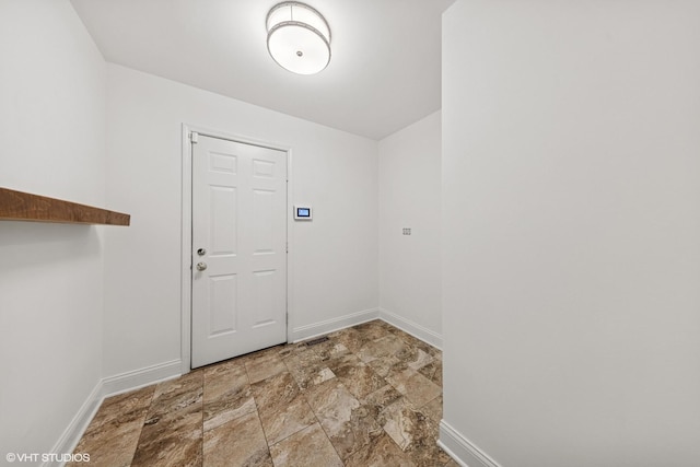 6724 Greene Rd, Woodridge, IL 60517 - laundry room featuring baseboards and stone finish floors