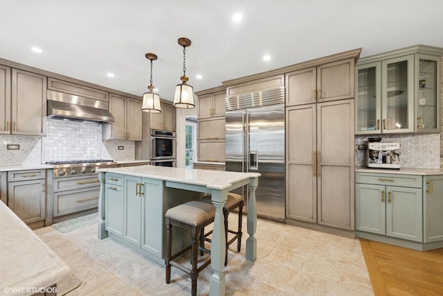 6724 Greene Rd, Woodridge, IL 60517 - kitchen featuring stainless steel appliances, wall chimney range hood, backsplash, recessed lighting, and a center island