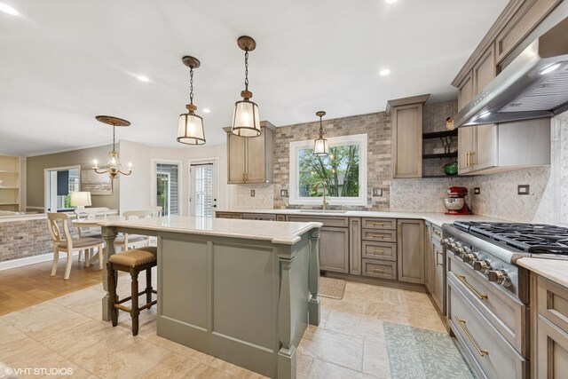 6724 Greene Rd, Woodridge, IL 60517 - kitchen with stainless steel gas cooktop, extractor fan, a sink, a kitchen island, and light countertops