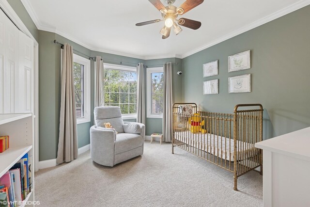 6724 Greene Rd, Woodridge, IL 60517 - bedroom with carpet floors, crown molding, a crib, baseboards, and a ceiling fan