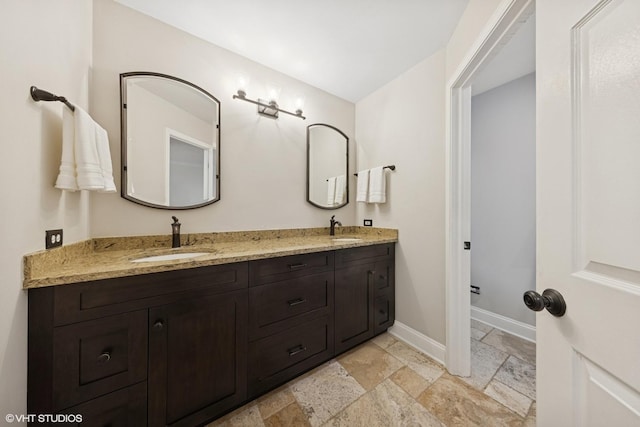 6724 Greene Rd, Woodridge, IL 60517 - full bathroom with stone tile flooring, double vanity, and baseboards