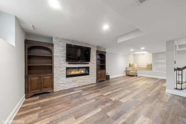 6724 Greene Rd, Woodridge, IL 60517 - unfurnished living room featuring built in features, baseboards, wood finished floors, a large fireplace, and recessed lighting