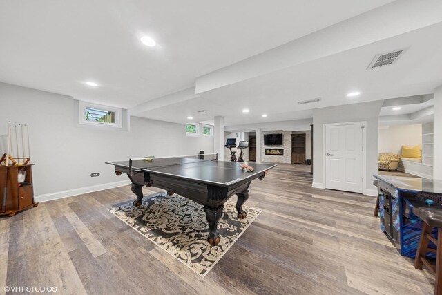 6724 Greene Rd, Woodridge, IL 60517 - rec room with wood finished floors, baseboards, recessed lighting, and a large fireplace