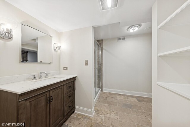 6724 Greene Rd, Woodridge, IL 60517 - full bathroom with baseboards, vanity, a stall shower, and stone finish floors