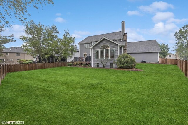 6724 Greene Rd, Woodridge, IL 60517 - rear view of house featuring a chimney and a deck