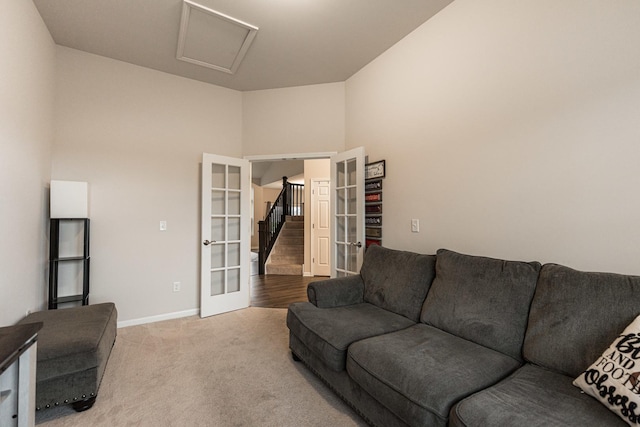 1125 Juniper Dr, Sycamore, IL 60178 - living area featuring french doors, attic access, carpet, and baseboards