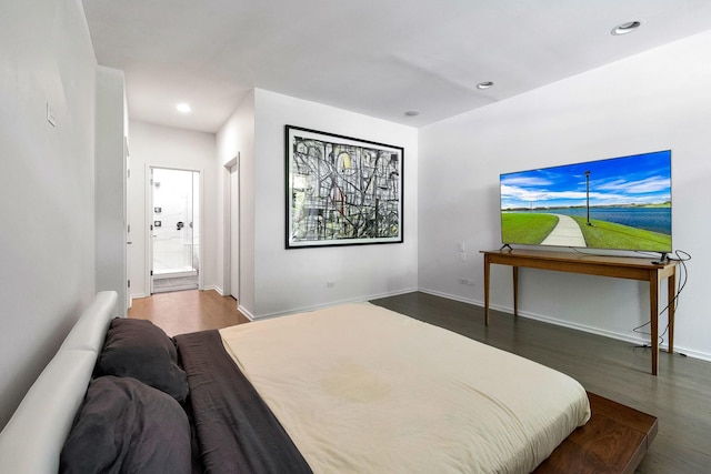 839 N Hermitage Ave Unit 101, Chicago, IL 60622 - bedroom featuring wood finished floors, recessed lighting, baseboards, and connected bathroom