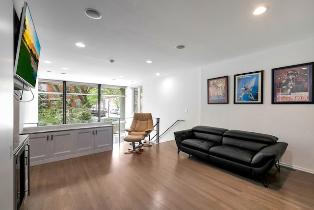 839 N Hermitage Ave Unit 101, Chicago, IL 60622 - living room with wood finished floors, recessed lighting, beverage cooler, and a wall of windows