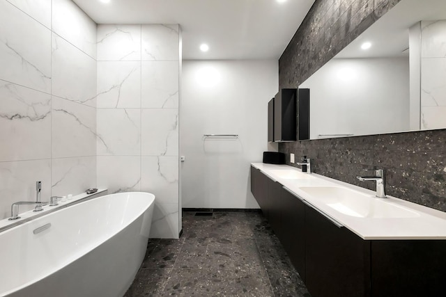 839 N Hermitage Ave Unit 101, Chicago, IL 60622 - bathroom with a soaking tub, double vanity, decorative backsplash, recessed lighting, and tile walls