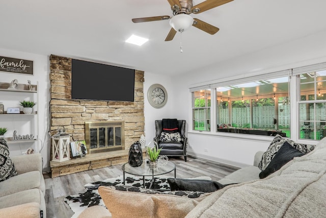 2310 Malik Ct, Glenview, IL 60025 - living area featuring wood finished floors, a ceiling fan, and a fireplace
