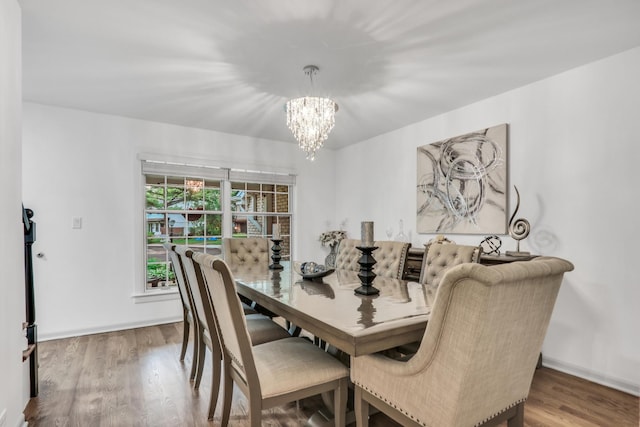 2310 Malik Ct, Glenview, IL 60025 - dining room featuring a chandelier, wood finished floors, and baseboards