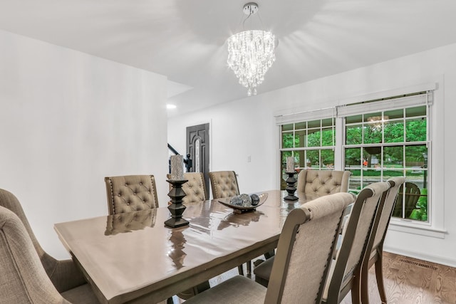 2310 Malik Ct, Glenview, IL 60025 - dining area with a chandelier and wood finished floors