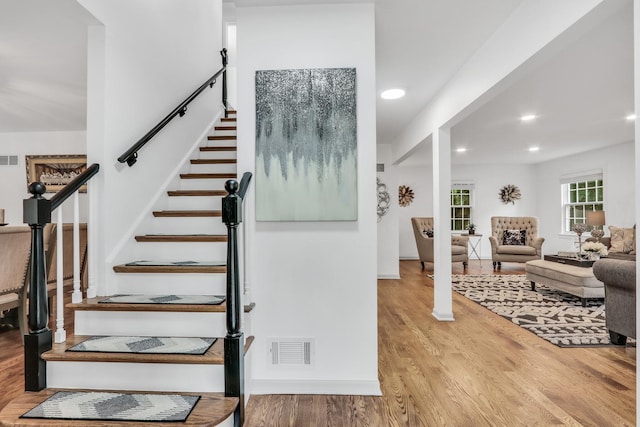 2310 Malik Ct, Glenview, IL 60025 - staircase with wood finished floors and recessed lighting