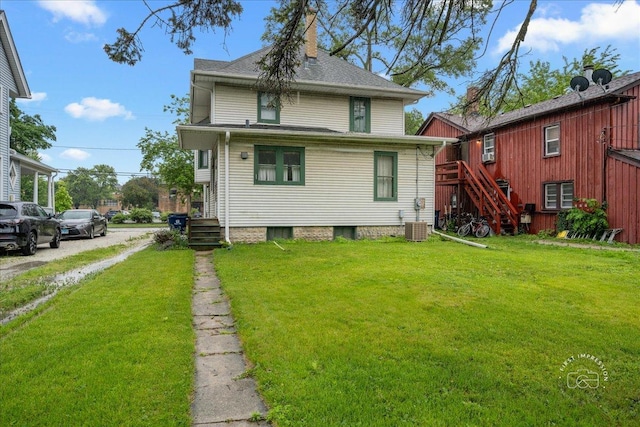 311 N Ave, Naperville, IL 60540 - back of house featuring stairs, central AC, and a yard