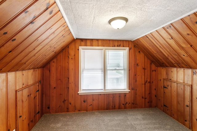 3256 186th St, Lansing, IL 60438 - additional living space with vaulted ceiling, wood walls, and carpet floors