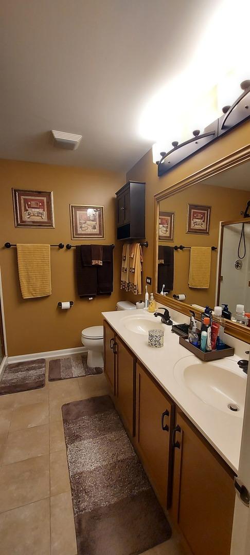 39806 Waterloo Dr, Beach Park, IL 60083 - full bathroom with double vanity, tile patterned floors, and a shower