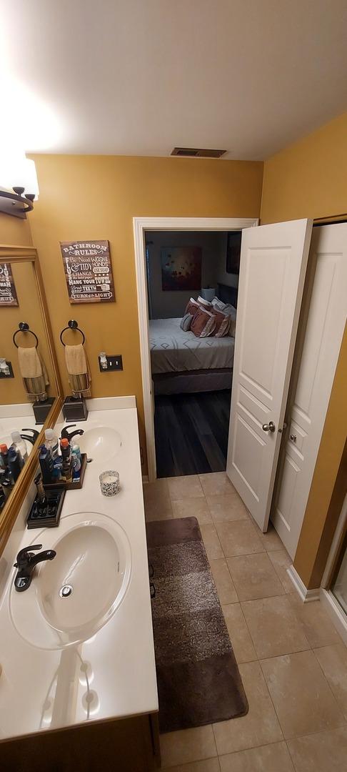 39806 Waterloo Dr, Beach Park, IL 60083 - ensuite bathroom with tile patterned flooring and double vanity