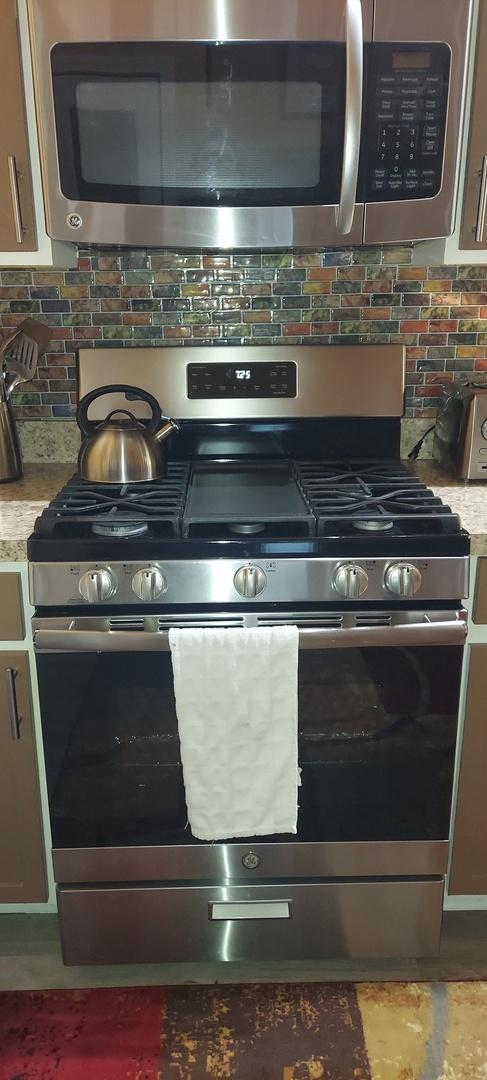 39806 Waterloo Dr, Beach Park, IL 60083 - kitchen view of appliances with stainless steel finishes and decorative backsplash