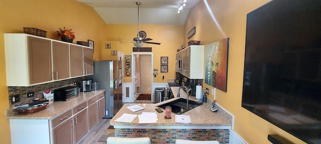 39806 Waterloo Dr, Beach Park, IL 60083 - kitchen with ceiling fan, decorative backsplash, stainless steel fridge, a peninsula, and high vaulted ceiling