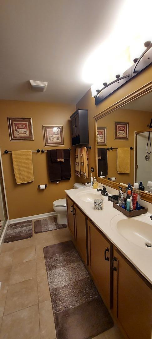 39806 Waterloo Dr, Beach Park, IL 60083 - full bathroom featuring tile patterned flooring, double vanity, and a shower stall