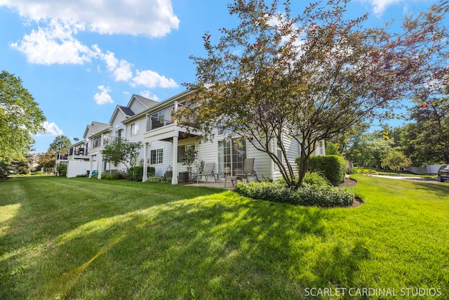 2312 Scott Ln Unit 2312, Aurora, IL 60502 - view of front of home featuring a balcony and a front lawn