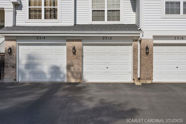 2312 Scott Ln Unit 2312, Aurora, IL 60502 - garage featuring driveway