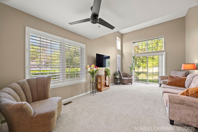 2312 Scott Ln Unit 2312, Aurora, IL 60502 - carpeted living room featuring baseboards and a ceiling fan