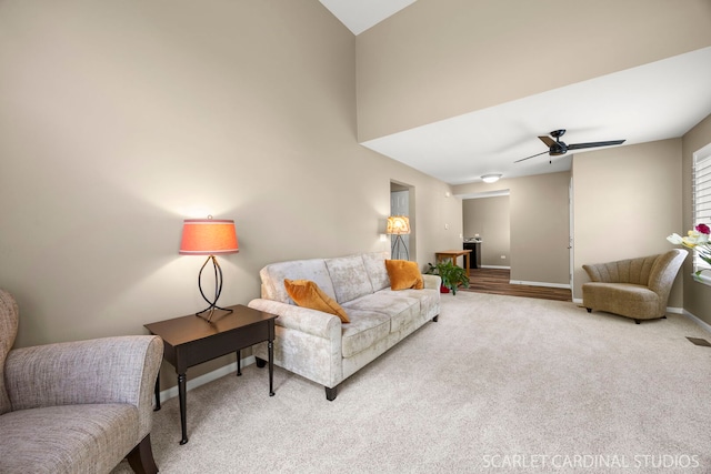 2312 Scott Ln Unit 2312, Aurora, IL 60502 - carpeted living room featuring baseboards and a ceiling fan