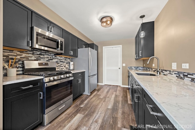 2312 Scott Ln Unit 2312, Aurora, IL 60502 - kitchen featuring stainless steel appliances, dark cabinets, tasteful backsplash, and dark wood-style floors