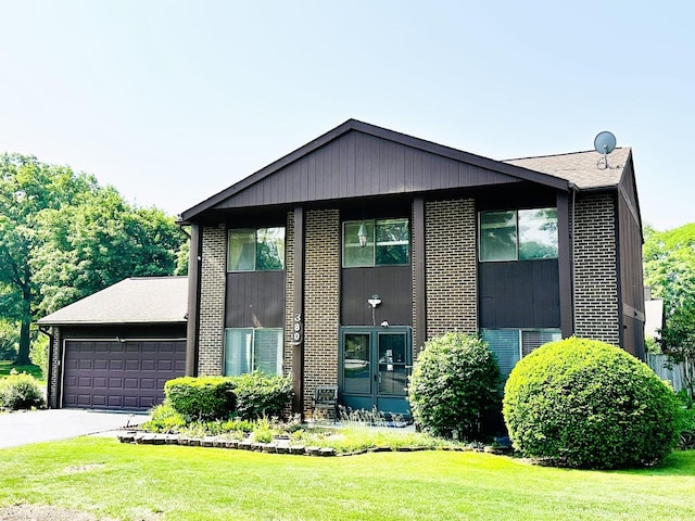 380 Ventura Club Dr, Roselle, IL 60172 - view of front of house featuring brick siding, a front yard, a garage, and driveway