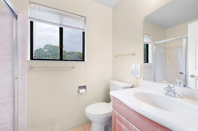 380 Ventura Club Dr, Roselle, IL 60172 - bathroom featuring tiled shower, vanity, and tile patterned flooring