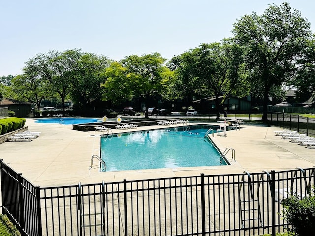 380 Ventura Club Dr, Roselle, IL 60172 - community pool featuring a patio area and view of wooded area
