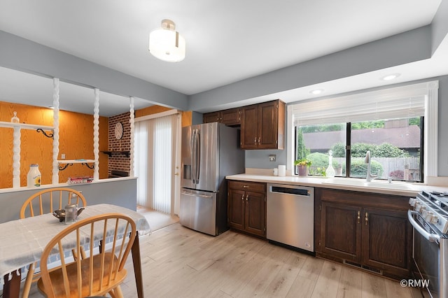 380 Ventura Club Dr, Roselle, IL 60172 - kitchen with stainless steel appliances, dark brown cabinetry, light countertops, light wood finished floors, and recessed lighting