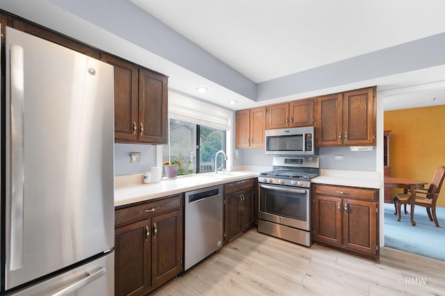 380 Ventura Club Dr, Roselle, IL 60172 - kitchen featuring appliances with stainless steel finishes, light countertops, light wood-style floors, and recessed lighting
